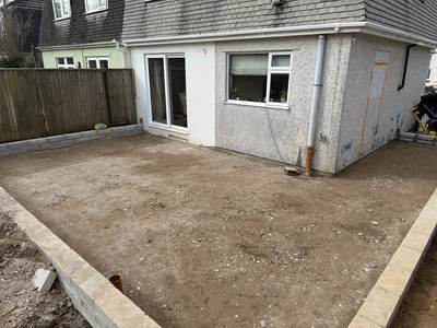 Extension groundworks at the rear of a house: blockwork brought up to ground level around a levelled area ready for the slab